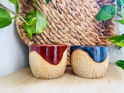 pair of carved cups